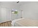 Bedroom featuring TV and double door closet for ample storage at 5944 Hickey Way, The Villages, FL 32163