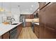 Modern kitchen with stainless steel appliances, ample cabinetry, and a large island at 5944 Hickey Way, The Villages, FL 32163
