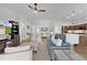 Open concept living room connects to dining and kitchen, creating a welcoming atmosphere at 5944 Hickey Way, The Villages, FL 32163