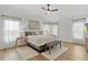 Bright bedroom with vaulted ceilings, natural light and calming decor at 5944 Hickey Way, The Villages, FL 32163