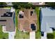 Overhead view of home with solar panels, a well-manicured lawn, and a driveway at 735 Palma Dr, Lady Lake, FL 32159