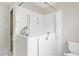 Walk-in bathtub with tile surround and handheld showerhead fixture at 735 Palma Dr, Lady Lake, FL 32159