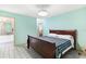 Bedroom features an ensuite bathroom and a tiled floor at 735 Palma Dr, Lady Lake, FL 32159