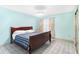 Bedroom with tiled floor, a full-sized bed, and natural light at 735 Palma Dr, Lady Lake, FL 32159