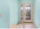 Inviting foyer featuring decorative glass front door and neutral tile flooring at 735 Palma Dr, Lady Lake, FL 32159