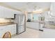 Kitchen with white cabinets, granite countertops, stainless steel appliances, and eat-in area at 735 Palma Dr, Lady Lake, FL 32159