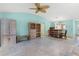 Inviting living area with tile flooring, open layout to dining and lots of natural light at 735 Palma Dr, Lady Lake, FL 32159