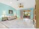 Bright and airy living room with tile flooring, ceiling fan and sliders to lanai at 735 Palma Dr, Lady Lake, FL 32159