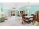 Open living room with dining area, tile floors, and sliding glass doors to screened porch at 735 Palma Dr, Lady Lake, FL 32159