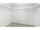 Spacious walk-in closet with metal shelving and tile flooring at 735 Palma Dr, Lady Lake, FL 32159