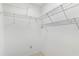 Bright walk-in closet featuring multiple wire shelving units for organized storage at 735 Palma Dr, Lady Lake, FL 32159