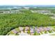 Aerial view showcasing a home in a well-forested area with ponds nearby at 780 Mystic Hill Ct, Kissimmee, FL 34759