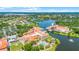 Breathtaking aerial view of the community's amenities, sparkling lake, and surrounding residences at 780 Mystic Hill Ct, Kissimmee, FL 34759