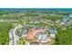Gorgeous aerial view of the community center, pool, and homes nestled within lush landscaping at 780 Mystic Hill Ct, Kissimmee, FL 34759