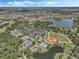 Wonderful aerial view showcasing the community baseball field, tennis courts and swimming pool near the lakes at 780 Mystic Hill Ct, Kissimmee, FL 34759