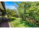 Backyard showing lanai and lots of lush tropical landscaping at 780 Mystic Hill Ct, Kissimmee, FL 34759