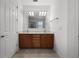 Bathroom features a double vanity with plenty of storage and a large mirror at 780 Mystic Hill Ct, Kissimmee, FL 34759