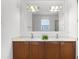 Bathroom boasts double sinks, a large mirror, and stylish vanity at 780 Mystic Hill Ct, Kissimmee, FL 34759