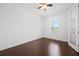 Bedroom with a ceiling fan, natural light, and wood flooring at 780 Mystic Hill Ct, Kissimmee, FL 34759