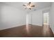 Bright bedroom featuring wood floors and a ceiling fan, exuding a cozy atmosphere at 780 Mystic Hill Ct, Kissimmee, FL 34759