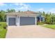 Charming single-story home featuring a brick driveway and a three-car garage at 780 Mystic Hill Ct, Kissimmee, FL 34759