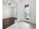 Inviting foyer with a decorative glass front door and hardwood floors visible in the bedroom at 780 Mystic Hill Ct, Kissimmee, FL 34759