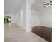 Hallway with tile flooring leading to living area and adjacent bedroom at 780 Mystic Hill Ct, Kissimmee, FL 34759