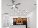 Stylish kitchen featuring wood cabinetry, black appliances, granite countertops, and pendant lighting at 780 Mystic Hill Ct, Kissimmee, FL 34759