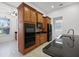 Well-equipped kitchen with stainless appliances, granite countertops, and maple cabinetry at 780 Mystic Hill Ct, Kissimmee, FL 34759