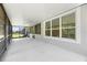 Spacious screened lanai with views of the yard through multiple screened windows at 780 Mystic Hill Ct, Kissimmee, FL 34759
