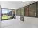 Enclosed lanai with ceiling fan, door to house, and access to the backyard at 780 Mystic Hill Ct, Kissimmee, FL 34759