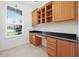 Office featuring built-in cabinetry, a desk, and a bright window view at 780 Mystic Hill Ct, Kissimmee, FL 34759