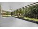 Large screened patio offering serene views of the lush backyard at 780 Mystic Hill Ct, Kissimmee, FL 34759