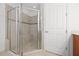 Walk-in shower with glass surround and a built-in bench at 780 Mystic Hill Ct, Kissimmee, FL 34759