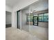 Enclosed sunroom with sliding glass doors and views of lush greenery at 780 Mystic Hill Ct, Kissimmee, FL 34759