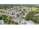 Captivating aerial view of a tranquil neighborhood with well-maintained homes and verdant landscaping at 8608 Se 141St Street Rd, Summerfield, FL 34491