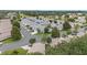 An elevated view captures a tranquil residential area featuring neat homes, winding roads, and mature trees at 8608 Se 141St Street Rd, Summerfield, FL 34491