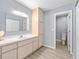 Bright bathroom featuring a large vanity with storage, a mirror, and a toilet at 8608 Se 141St Street Rd, Summerfield, FL 34491