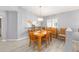 The dining area is open to the kitchen and the living area and features wood-look floors at 8608 Se 141St Street Rd, Summerfield, FL 34491