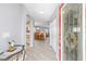 Inviting foyer with elegant flooring and an open view of the dining and living areas at 8608 Se 141St Street Rd, Summerfield, FL 34491