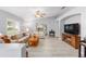Living area features neutral paint, wood-look floors and is open to the dining area at 8608 Se 141St Street Rd, Summerfield, FL 34491