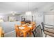Open concept living space with dining area features neutral paint and wood-look floors at 8608 Se 141St Street Rd, Summerfield, FL 34491