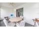 Enclosed patio with ceiling fan, table, chairs, and easy access to home's interior at 8608 Se 141St Street Rd, Summerfield, FL 34491