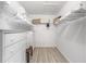 Well-organized walk-in closet with shelving, drawers, and ample storage space at 8608 Se 141St Street Rd, Summerfield, FL 34491