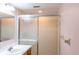 Clean bathroom with a shower and vanity, offering functionality and convenience at 8705 Village Green Blvd, Clermont, FL 34711