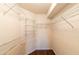 Organized walk-in closet providing ample shelving and storage space at 8705 Village Green Blvd, Clermont, FL 34711