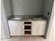 Bathroom vanity with double sinks and granite countertop, plus storage at 919 Cr 482C, Lake Panasoffkee, FL 33538