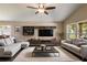 Spacious living room with modern furnishings, a ceiling fan, and lots of natural light at 919 Cr 482C, Lake Panasoffkee, FL 33538