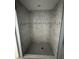 New bathroom shower with gray tile and a decorative accent stripe at 919 Cr 482C, Lake Panasoffkee, FL 33538