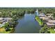 Aerial view of the community lake surrounded by lush trees and greenery at 926 Wood Briar Loop, Sanford, FL 32771